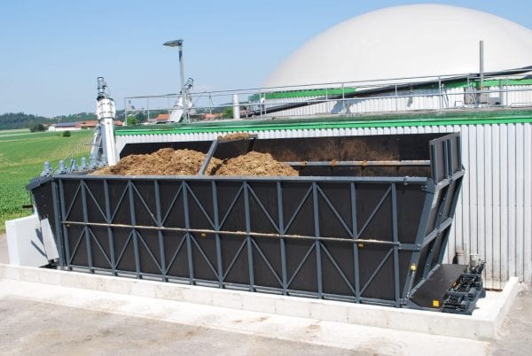 Biogas plant with a big dosing container