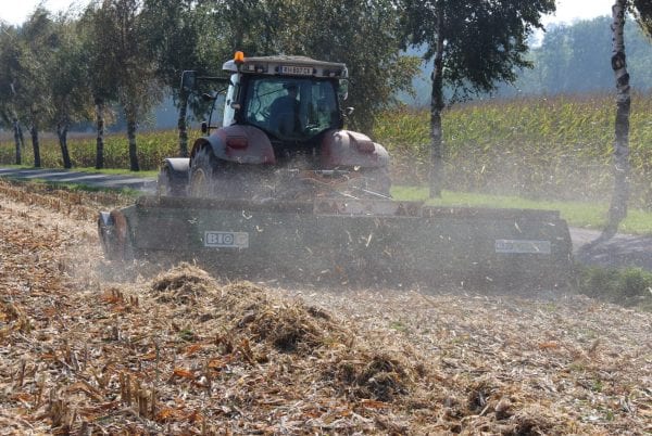 A tractor with BIOCHIPPER at the rear during harvesting crops